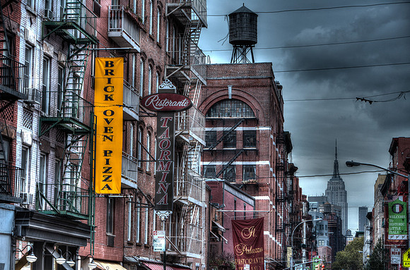 New York City street view - Empire State building in the distance.